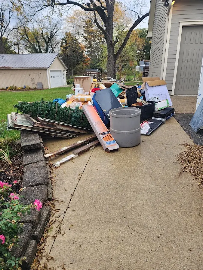 Dumpster being loaded with debris for Estate Cleanout Dumpster Rental in Markham